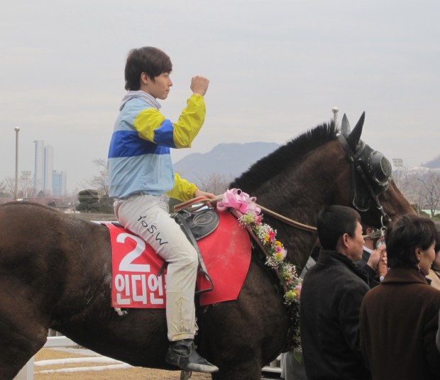 Indian Blue and Yoo Seung Wan, both in the Stakes winner's circle for the first time