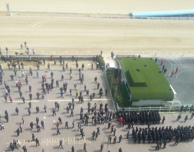 Riot police form their lines. They were not eventually deployed.